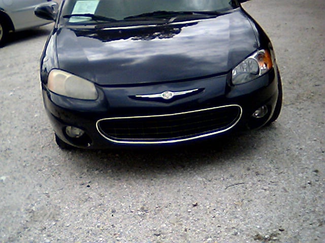 Front Of Car With One Clean Headlight And One Foggy